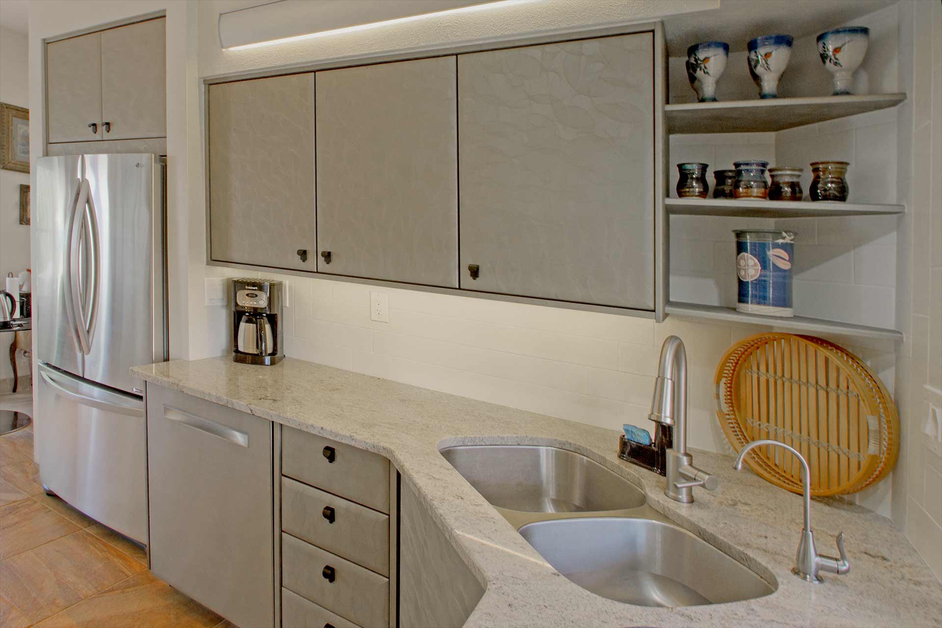 Alvernas kitchen sink and cabinets
